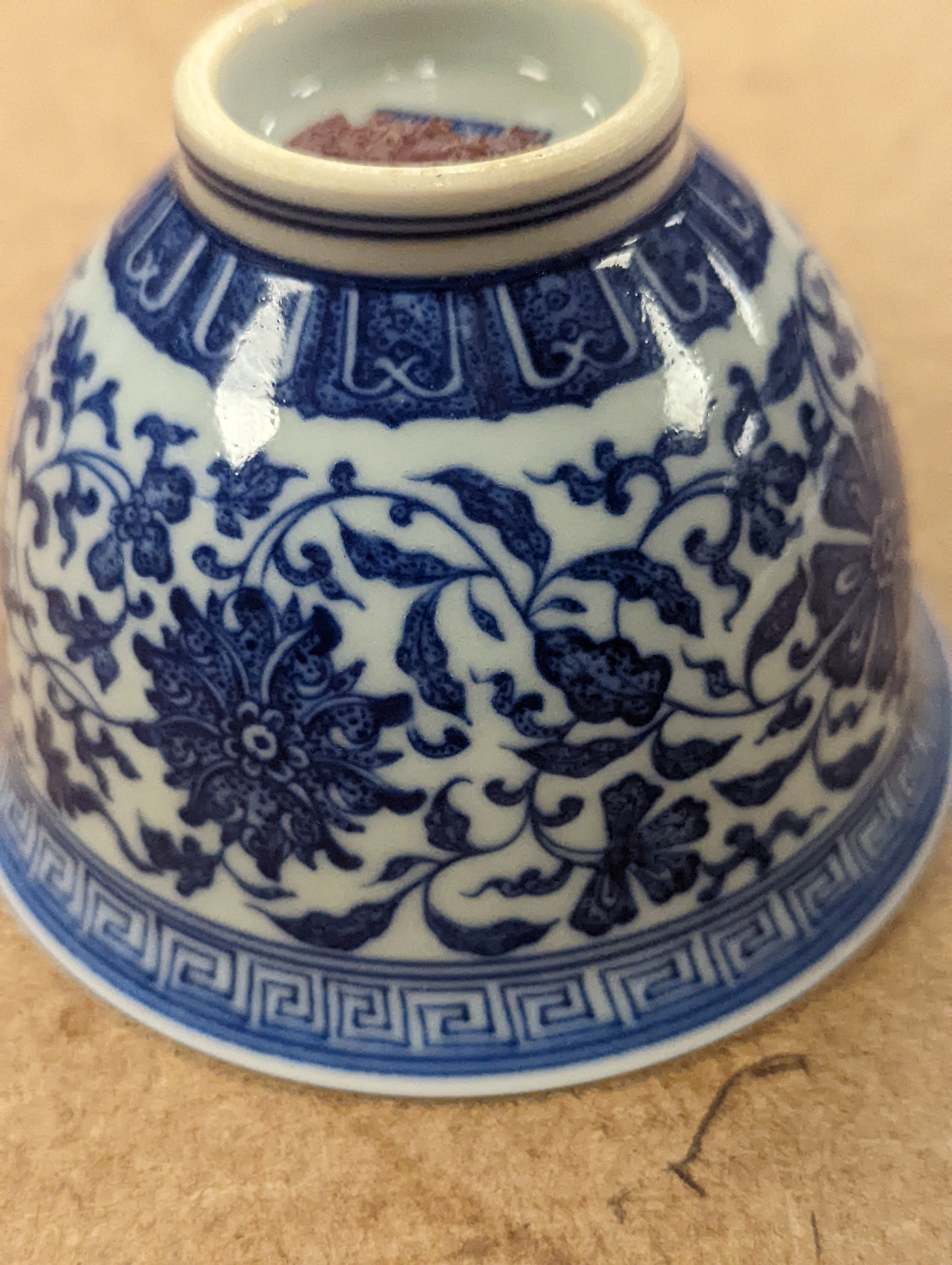 A Chinese blue and white 'lotus' cup. 9cm diameter